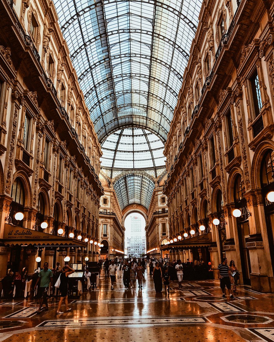 Famous luxury shopping gallery with ornamental buildings located in Milan