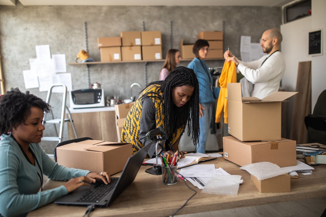 Multi-ethnic e-commerce team working at office together