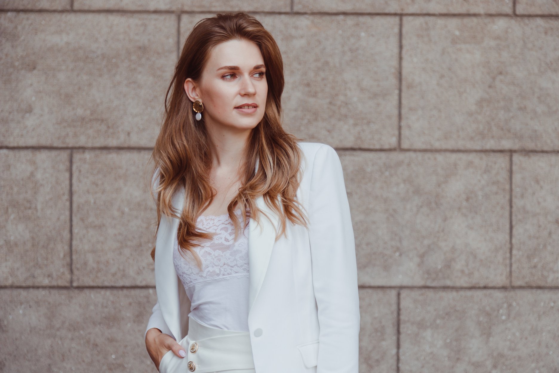 Elegant Woman in White Blazer Looking Away Outdoors