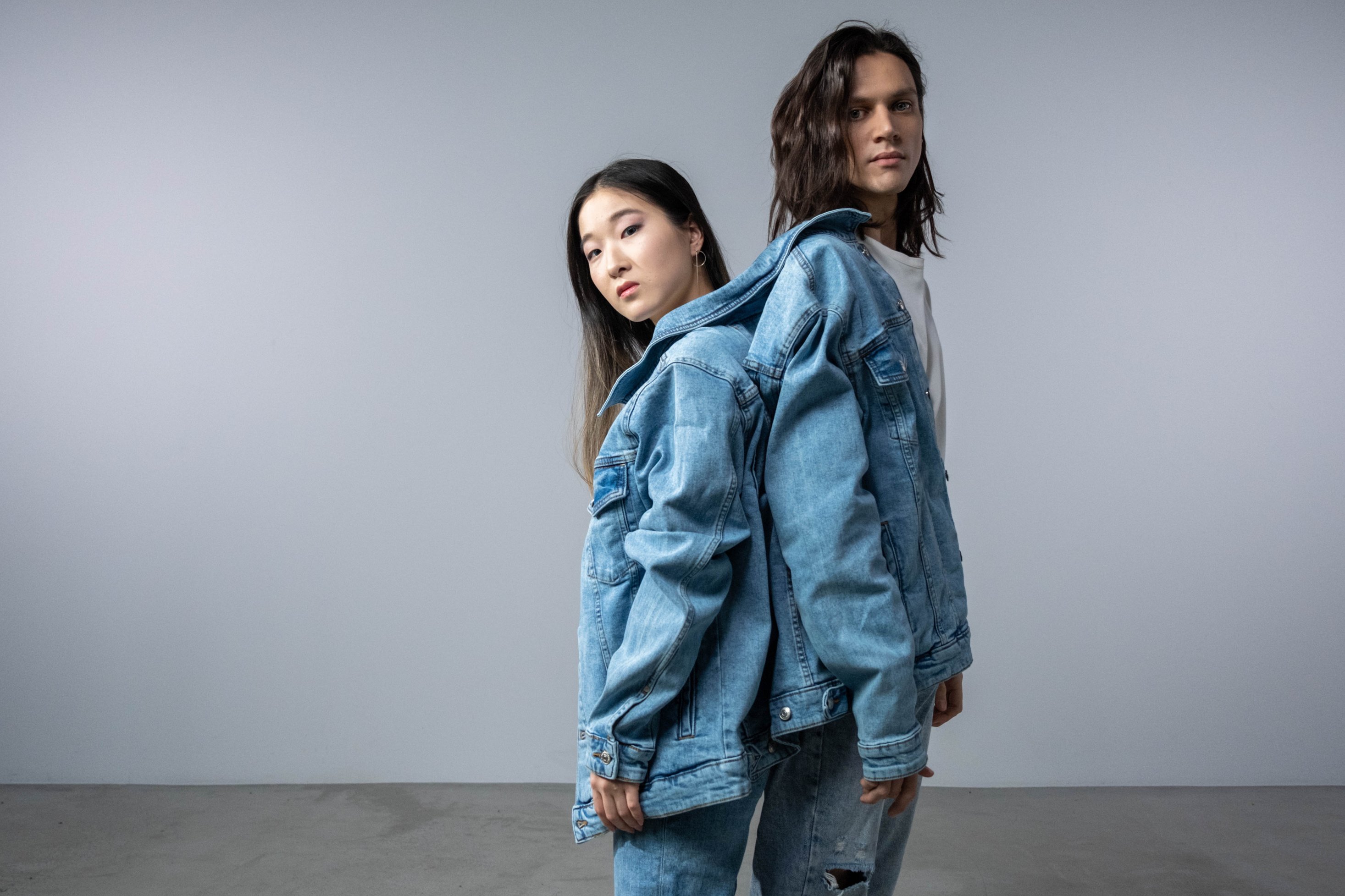 Man and Woman in Blue Denim Jacket and Blue Denim Jeans