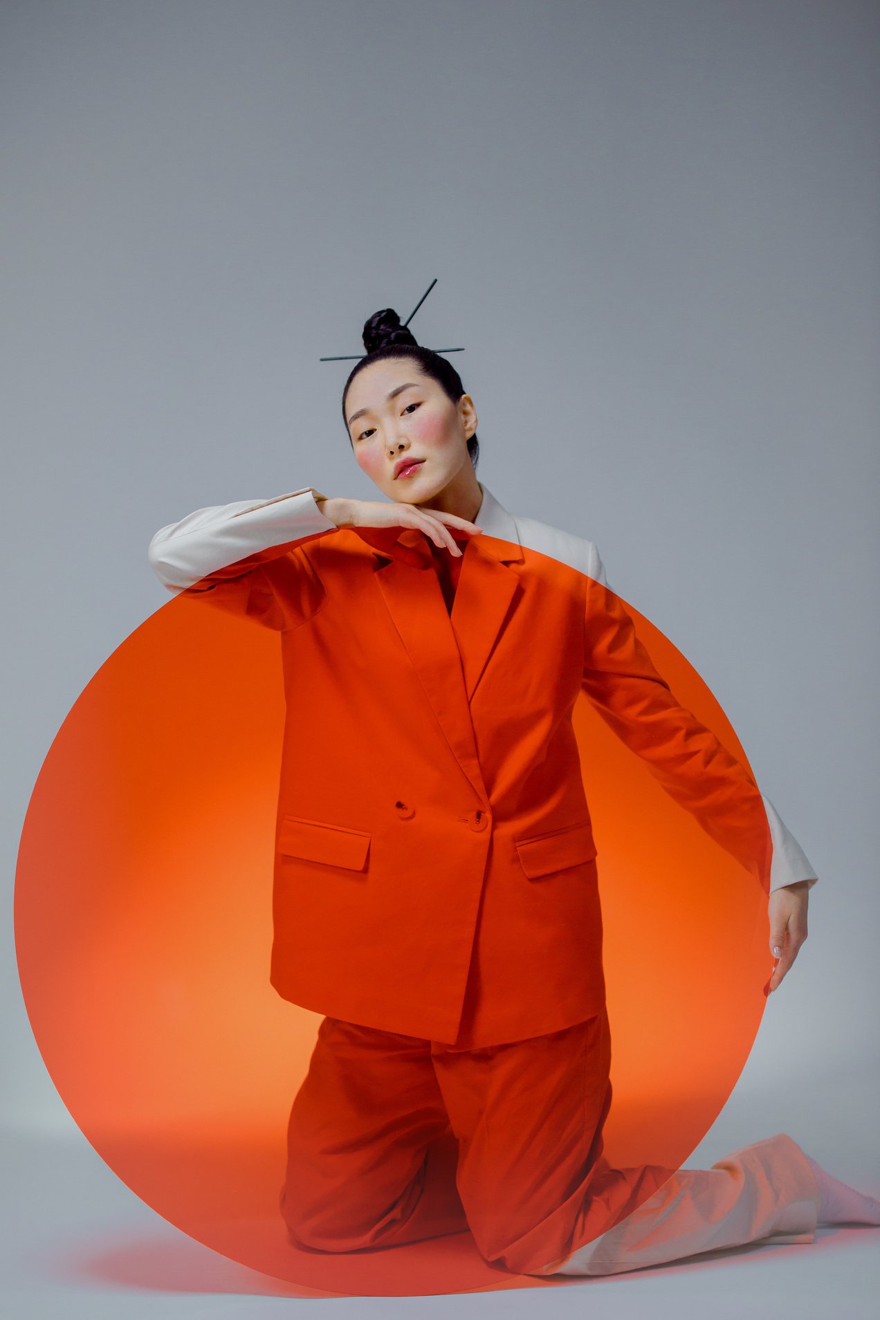 Woman in Orange Blazer Standing